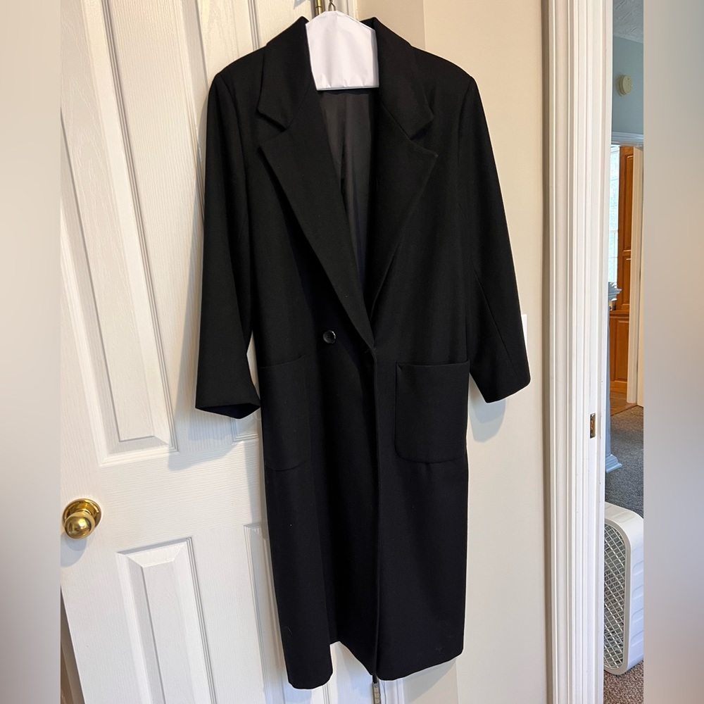 Very warm wool long winter coat.Good condition except for small hole by pocket.